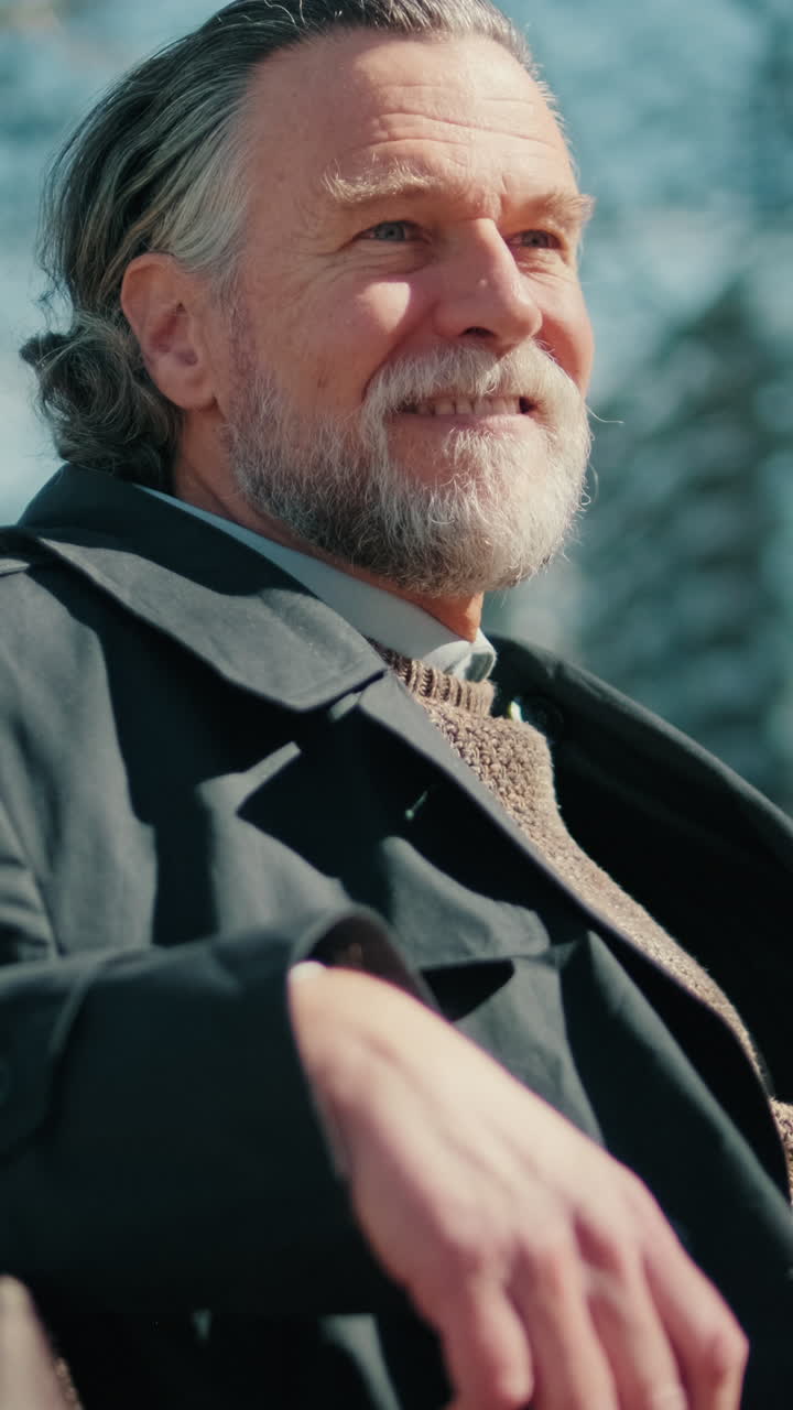 Happy Senior Man Relaxing in a City Park
