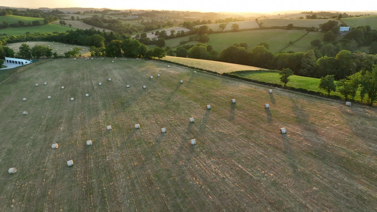 Hay Bales in Farmland - Aerial View Countryside at Sunset