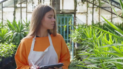 woman working in a greenhouse