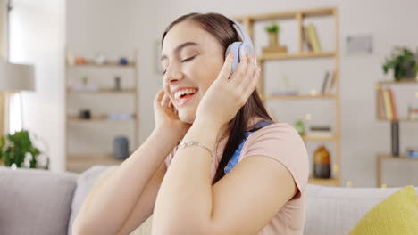 Music,-headphones-and-happy-woman-on-couch