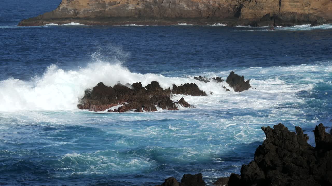 Waves Crashing On Rocks On The Coast Of Madeira, Portugal