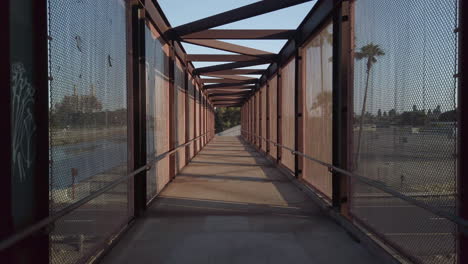 crossing footbridge over canals and highway