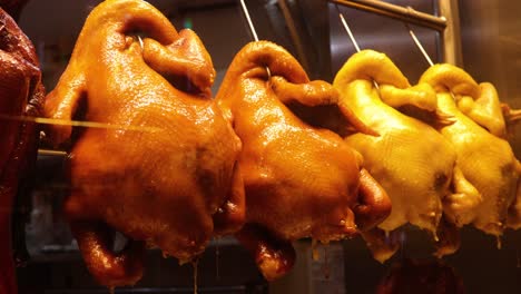 crispy roasted poultry hanging in hong kong shop