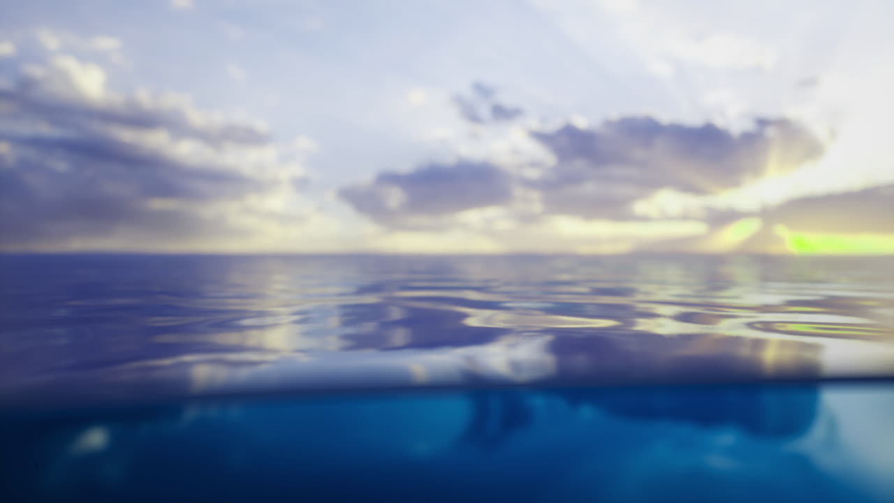 Calm water reflecting clouds during sunset at a serene coastal location