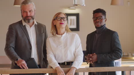 portrait of mixed age multiethnic business team in restaurant