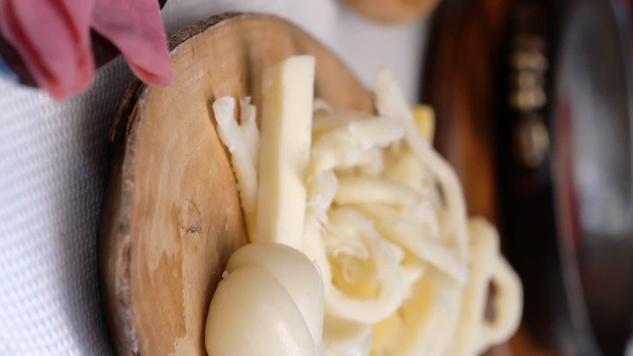 Assortment of Cheeses on Wooden Board