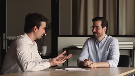 two diverse businessmen shaking hands accomplish successful negotiations