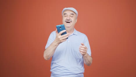 dancing old man with phone in hand.