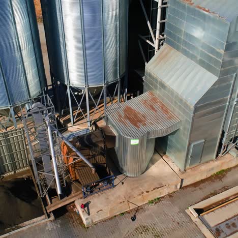 grain warehouse, granary. large steel towers for storing crops. large animal feed factory. aerial view