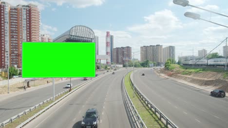 green screen blank billboard on a busy street