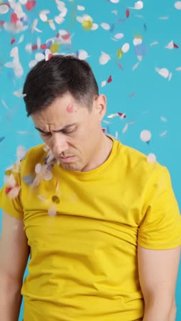 man covered in confetti