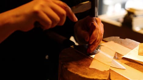 sharpening a knife with a hammer and tool