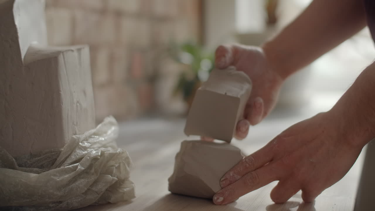 Hands Shaping Clay Sculpture