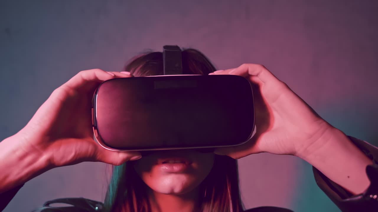 Young beautiful woman in a leather jacket putting virtual reality head set on her eyes