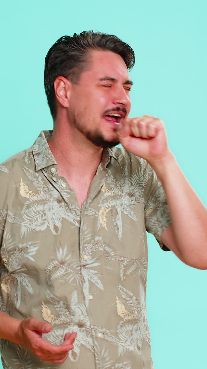 Man singing passionately into imaginary microphone expressing joy enthusiasm for musical performance