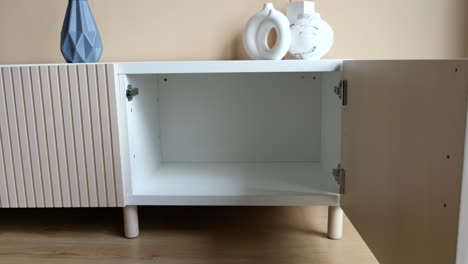 modern white and beige tv stand with open cabinet