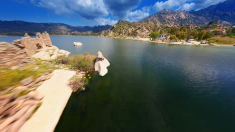 fpv drone flying over ancient ruins on island