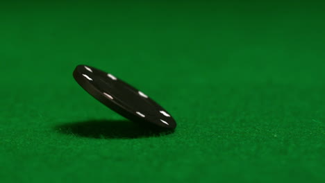 black chip spinning on casino table