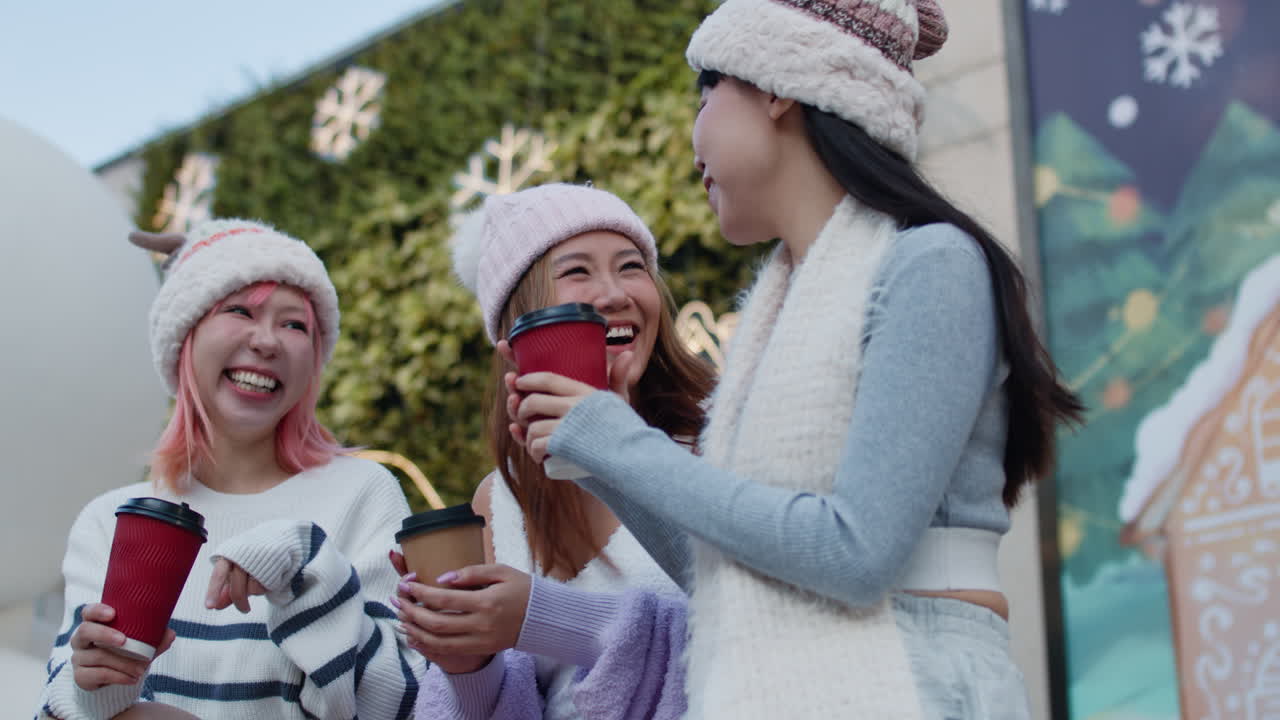 Three friends enjoying winter together with coffee