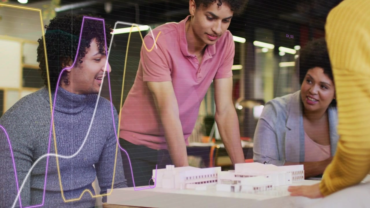 Project team leaning around white model as host moving parts, discussing layout while waves growing