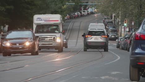 traffic, cars, headlights along baltimore avenue, west philadelphia, twilight