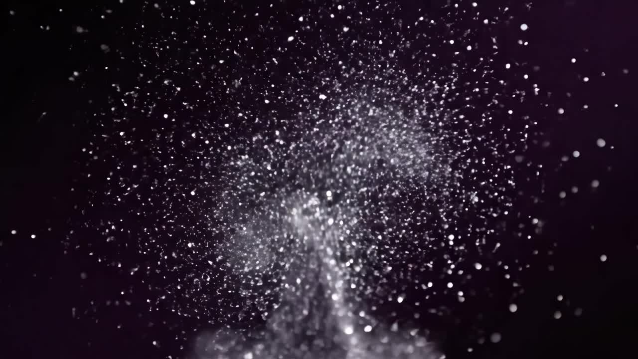 Abstract glitter explosion on a dark background