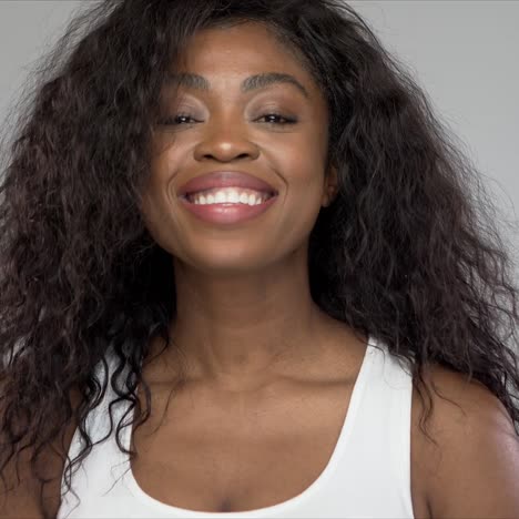 happy black woman laughing for camera