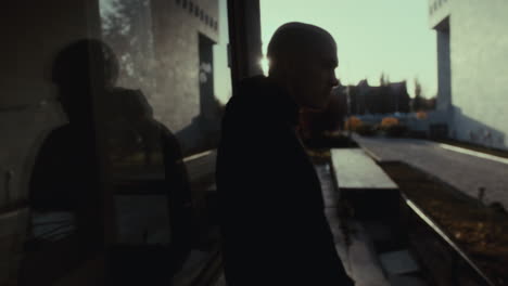 person walking in a city building complex