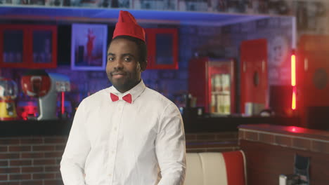 waiter smiling in a typical american diner