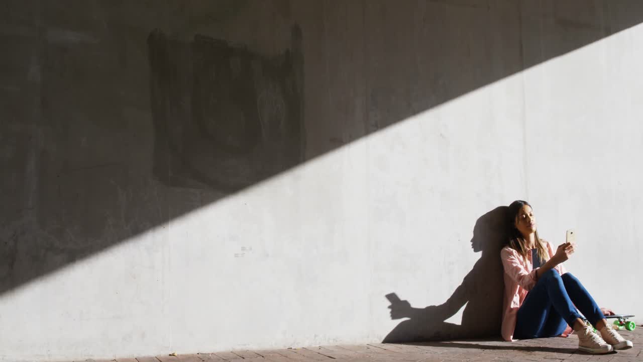 Woman using mobile phone under flyover 4k