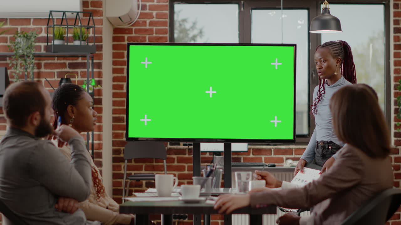 Business people doing presentation with green screen on monitor