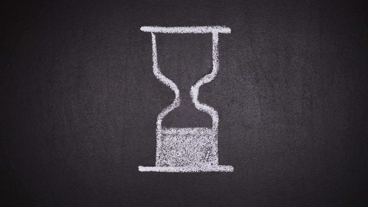 Loop animation of hourglass rotating on blackboard