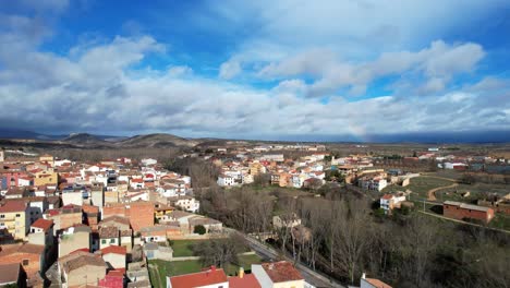 aerial panoramic view of landete, a rural spanish village on a cloudy and windy day