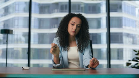 Woman-analysing-holographic-data-operating-digital-animation-in-office-close-up.