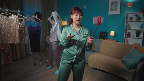 two women in pajamas creating fashion content