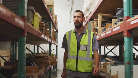 Worker-walking-between-two-shelves