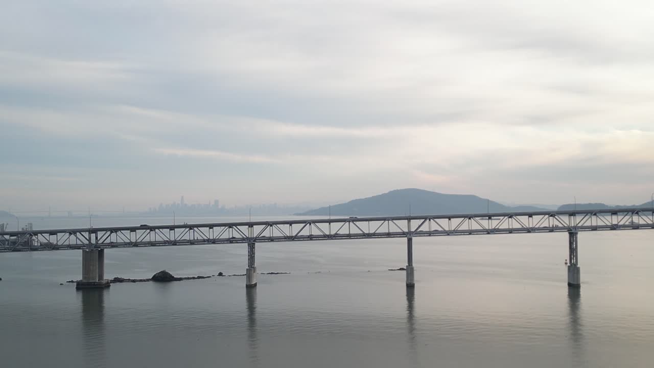 Cars drive on double decker road of Richmond Bridge from Point Molate Beach Richmond California USA