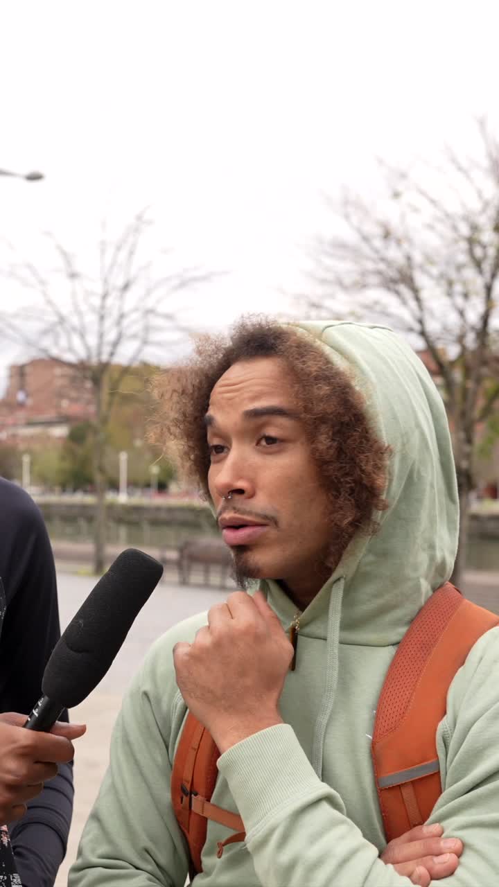 Interview with man and woman in urban setting
