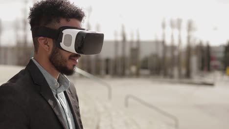 young man using vr headset outdoor