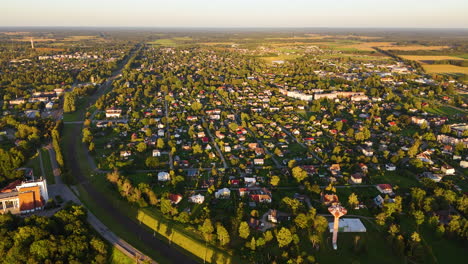 aerial view over the town of sigulda in vidzeme, latvia. 4k establishing shot of residential real estate.
