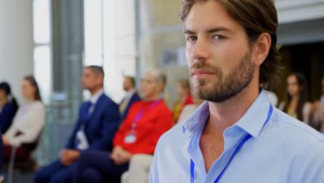 Businessman-sitting-with-his-laptop-in-the-business-seminar-4k