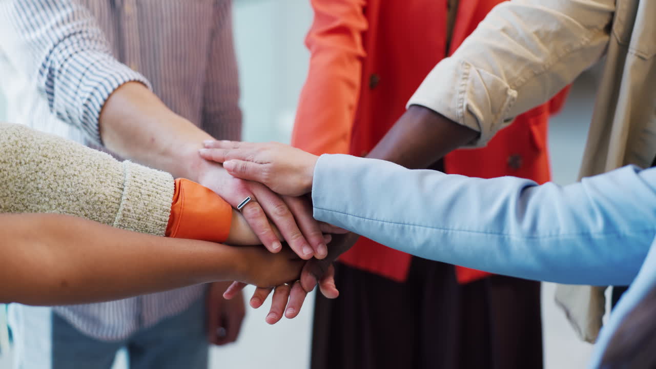 Close Up of Diverse Hands Stacking Together for Teamwork