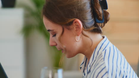 Focused-Woman-Drinking-Water-During-Computer-Work