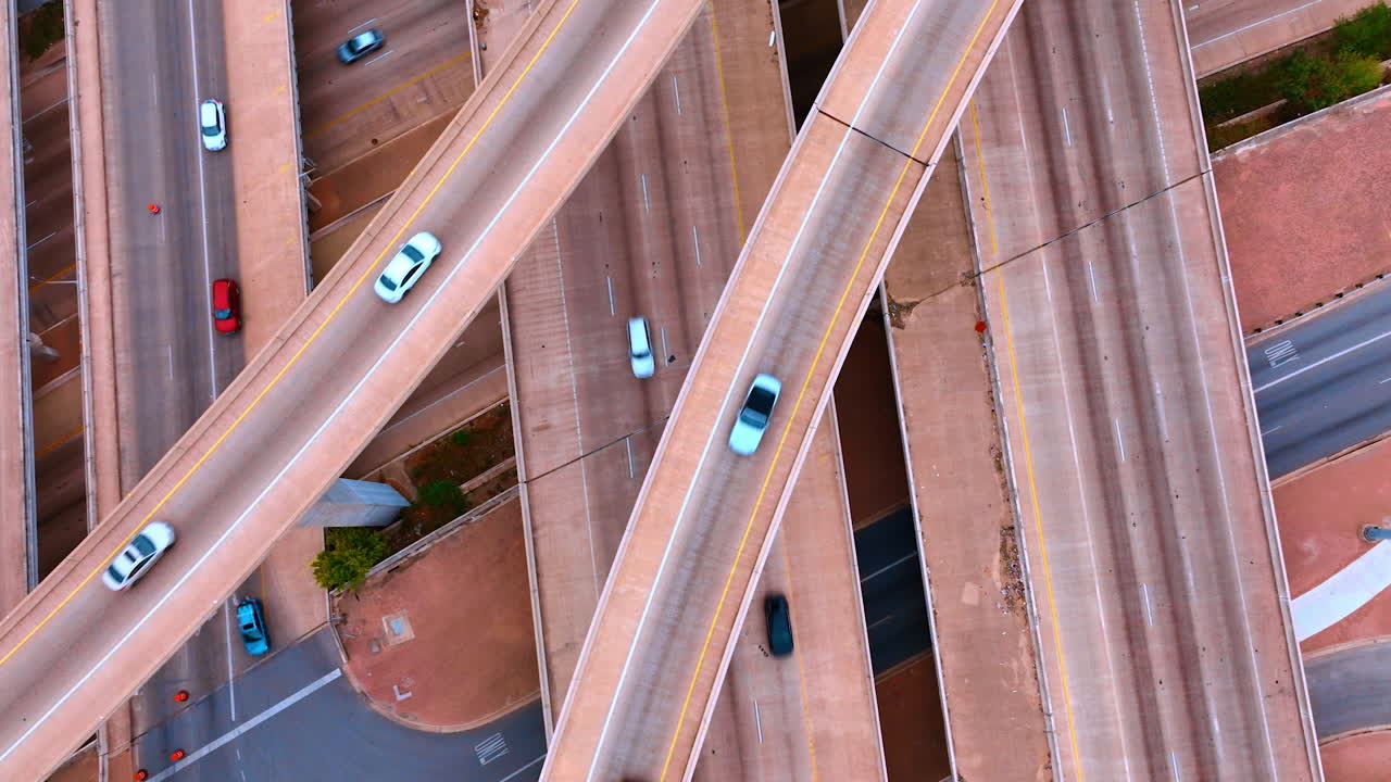 Transport moving by the roads and trestles. Top view on the traffic in the lively city