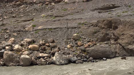 hunza valley river, rocky stone boulders nature landscape pakistan south asia