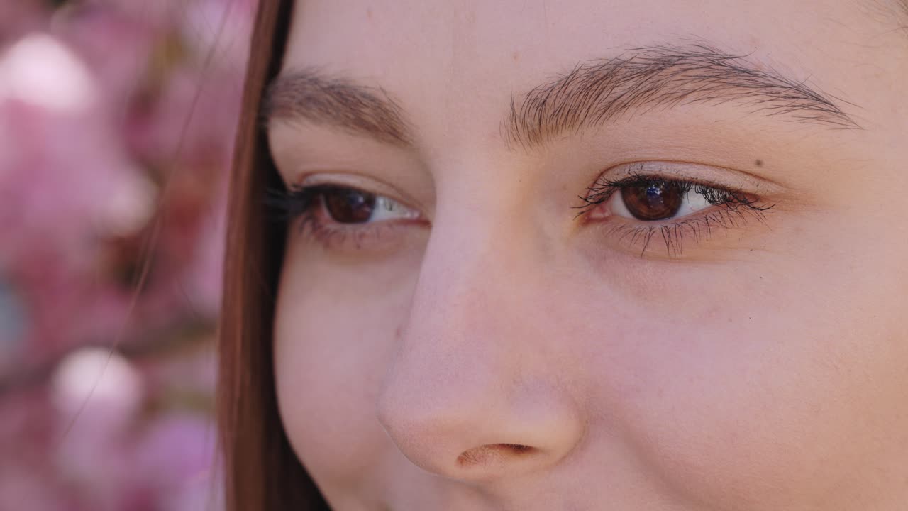 Close-up of a young woman's face, profile view