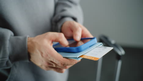 person using a mobile phone at the airport