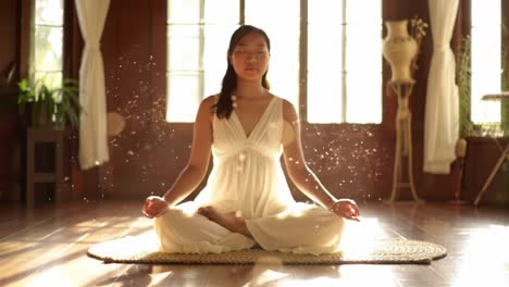 serene meditation in a sunlit room: a woman embraces peace and tranquility through mindfulness and inner reflection