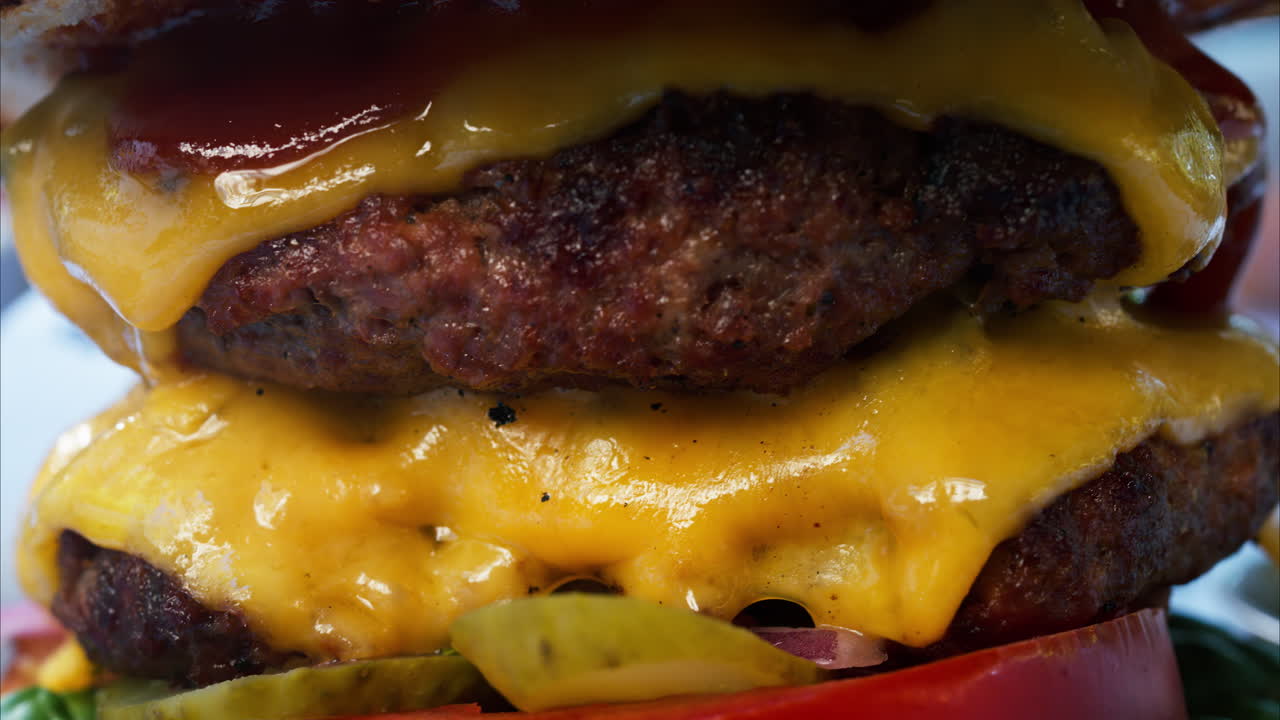 Close up of a big hamburger on a table at a restaurant