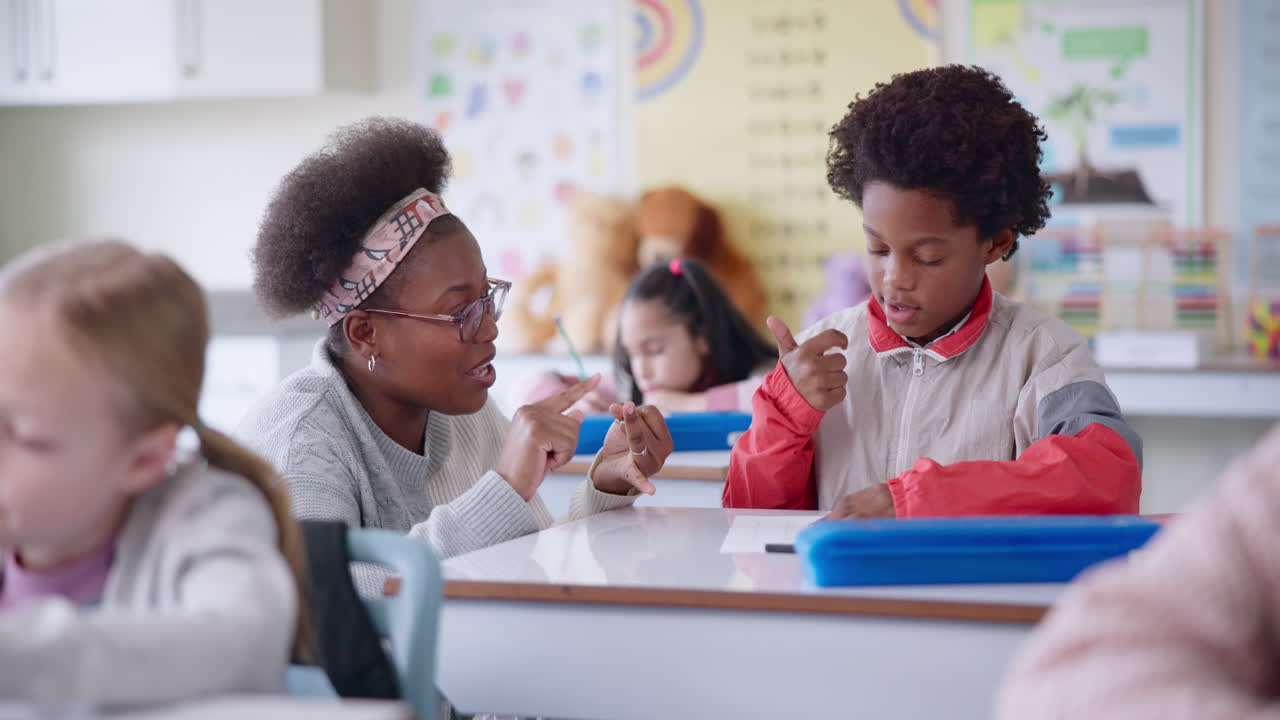 Teacher assisting a student in a diverse classroom setting
